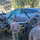 A crane is used to lift car Tiger Woods was driving in rollover accident in the Rancho Palos Verdes suburb of Los Angeles.